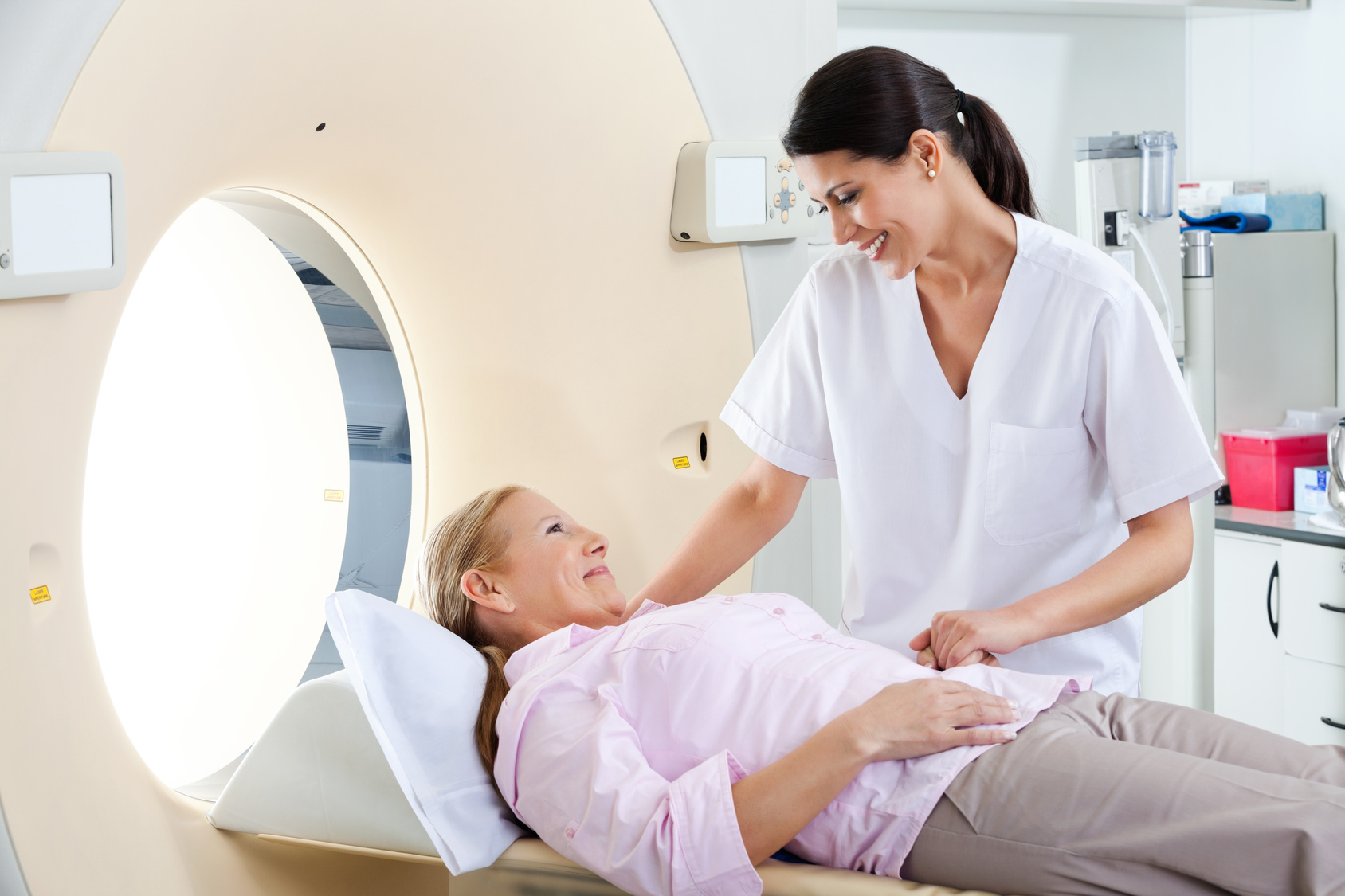 technician talking to patient before scan