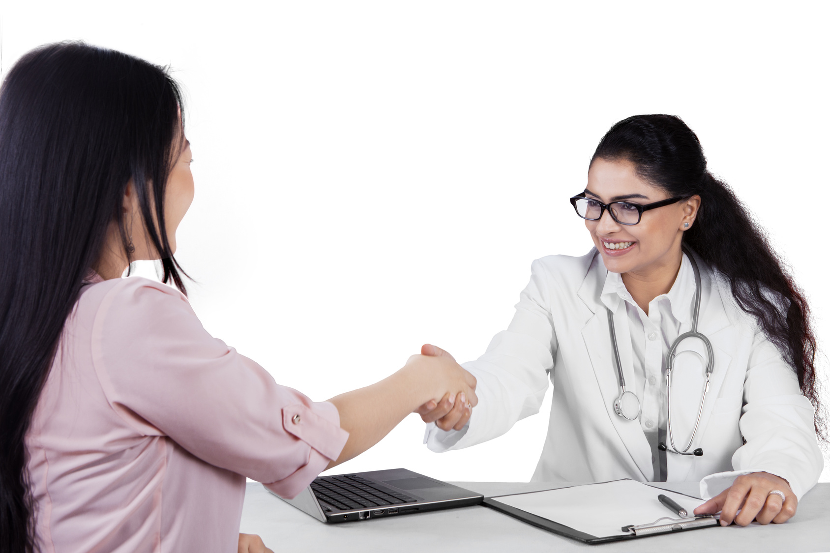 doctor and patient shaking hands and smiling