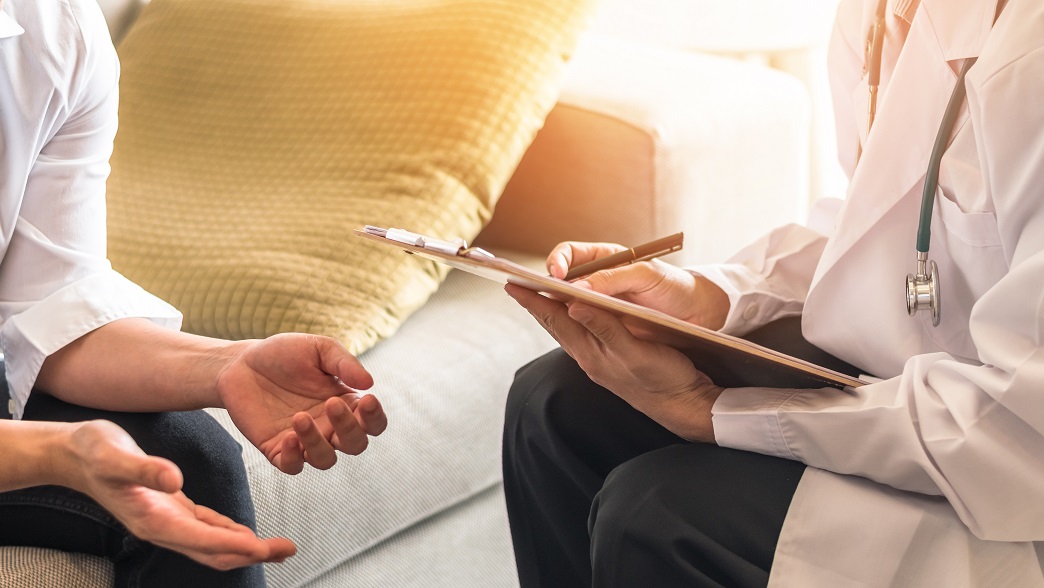 Doctor consulting woman
