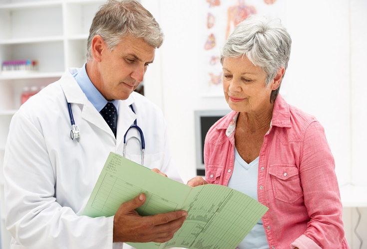 Doctor talking to older woman