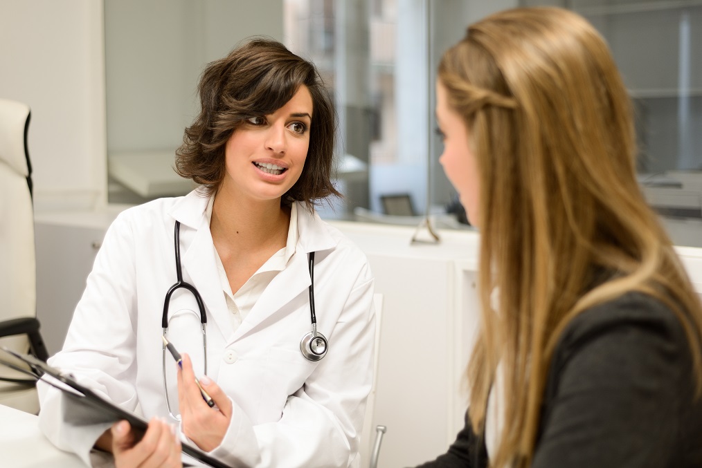 Doctor talking to young patient