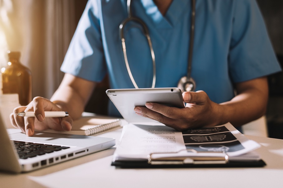 Doctor working with mobile phone and stethoscope