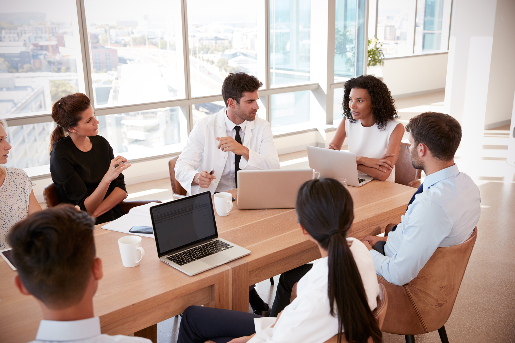 Medical professionals around table