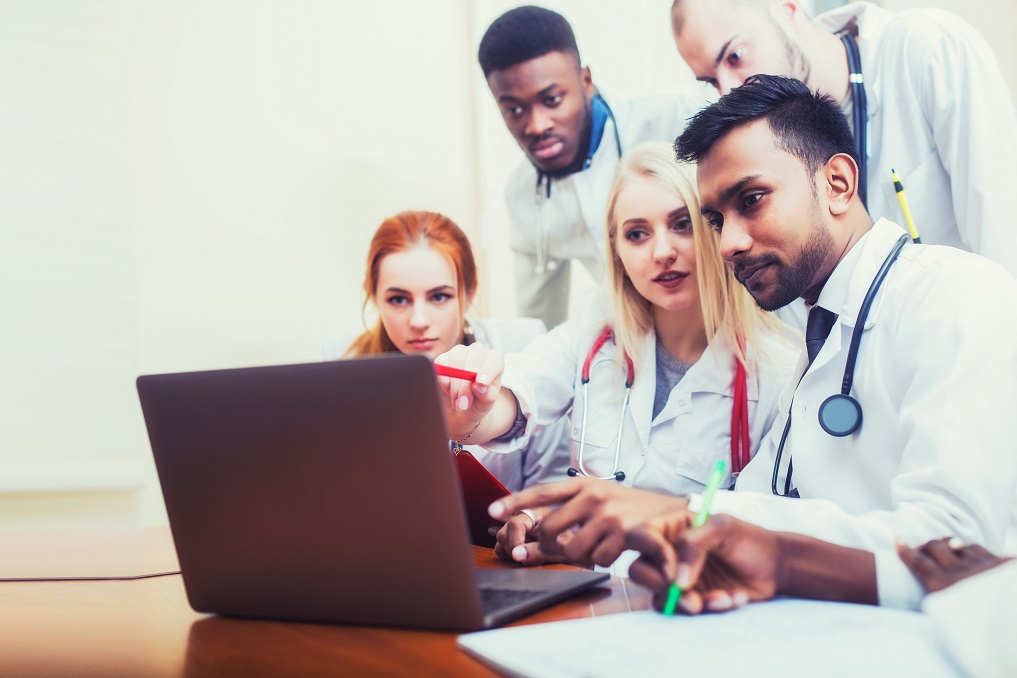 Medical students in front of laptop