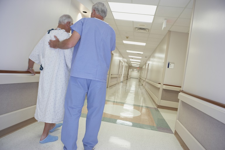 Nurse helping patient walk