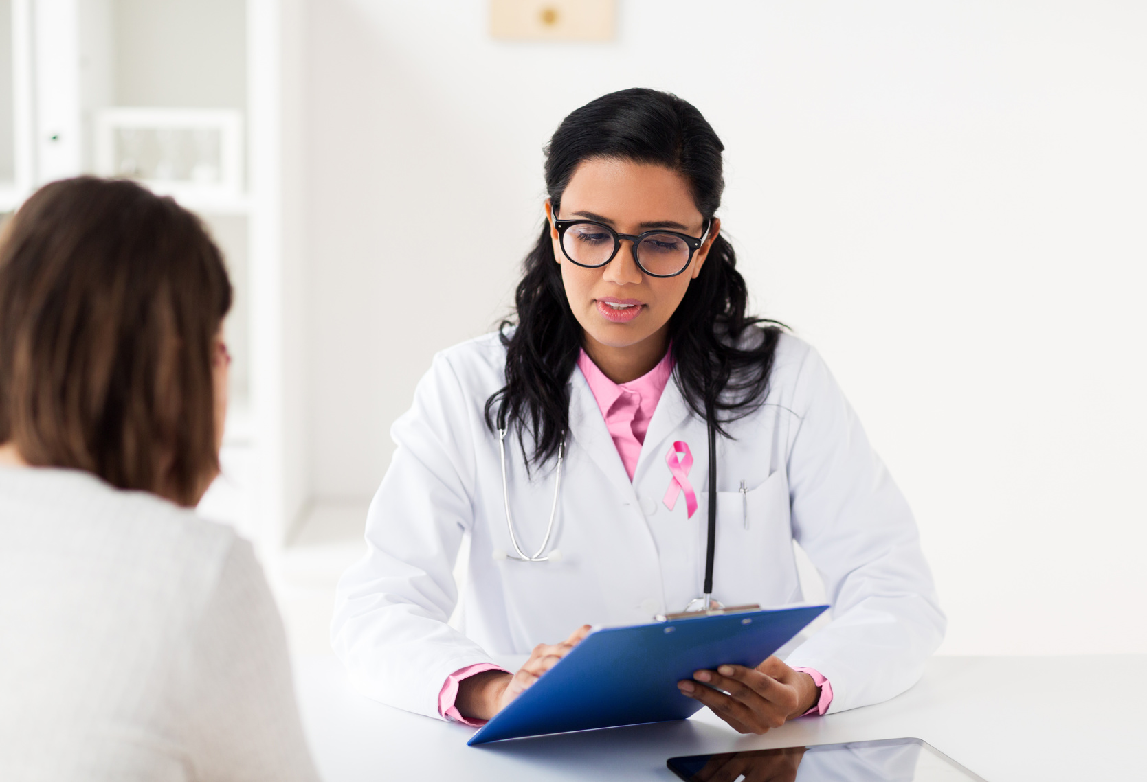 Woman reviewing results with doctor